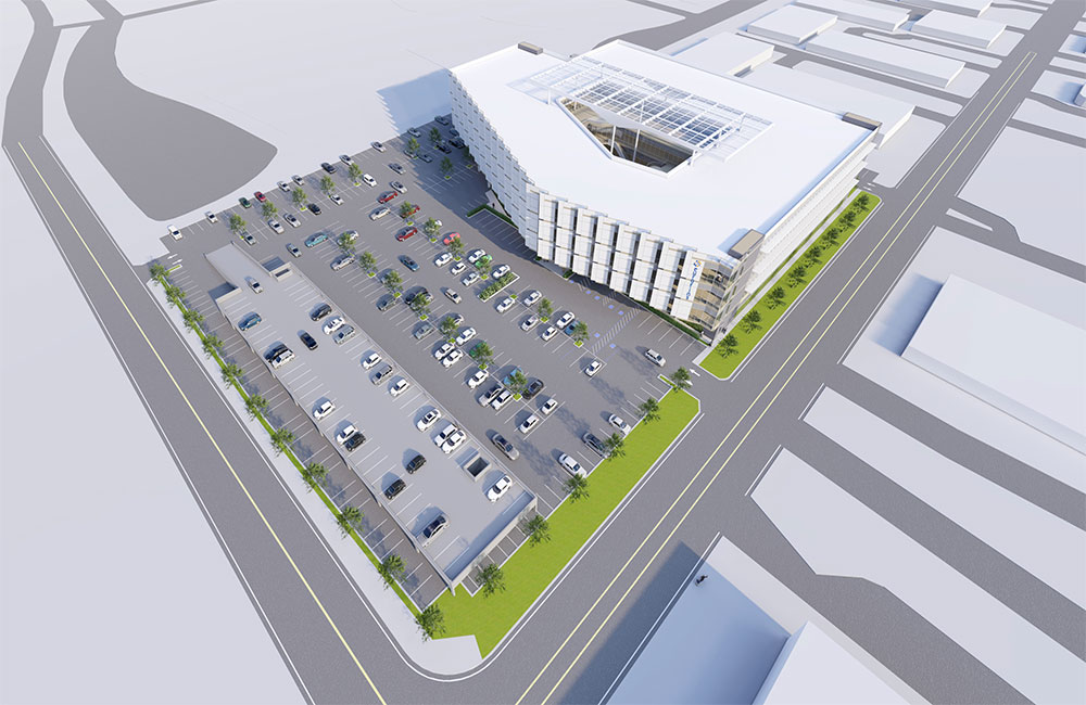 Image 1. Aerial view rendering of modern 4-story building clad with white metal panels located next to a parking lot.